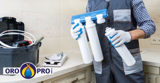 Plumber installing water softener system